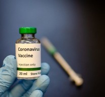 How are clinical trials performed to develop a vaccine?